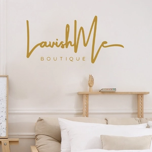 Golden Lavish Me BOUTIQUE wall decal displayed in a modern bedroom with minimal furniture