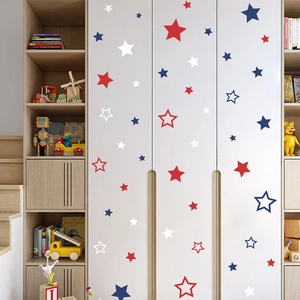 Red white and blue pentagram wall stickers for nursery decor on a white wardrobe
