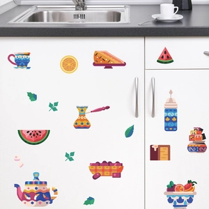 DIY kitchen wall stickers featuring hand-drawn teapots, cakes, and fruit on a white cabinet