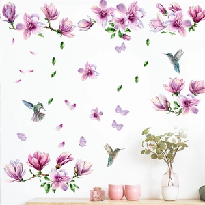 Purple magnolia and bird wall decals in watercolor style on a minimalist white living room wall