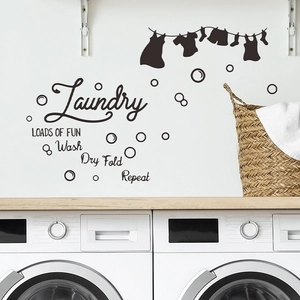 Laundry room wall decal with Loads of Fun text and hanging clothes silhouettes