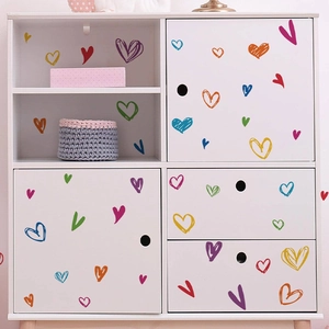 Colorful graffiti heart wall stickers for home decor on white storage cabinets