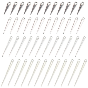 Macro view of multiple antique silver gothic spike charms for DIY jewelry making