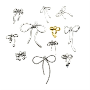 Set van 11 vintage strik-bedeltjes van legering voor DIY-kettingen en armbanden