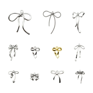 Set van 11 vintage strikbedeltjes van legering in zilver en goud voor DIY-sieraden
