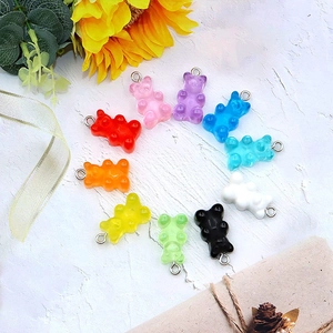 Set of ten colorful semi-transparent resin gummy bear charms with silver metal eyelets