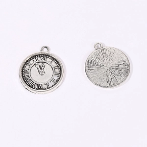 Antique silver steampunk clock pendant with Roman numerals and sunburst texture