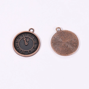 Detail view of steampunk bronze clock pendants with Roman numerals on white background