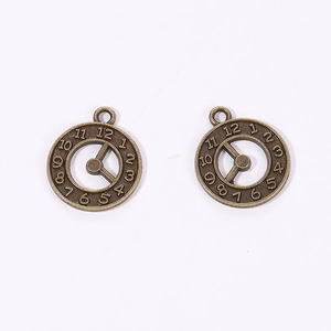 Detailed close-up of antique bronze steampunk clock gear pendants for DIY jewelry