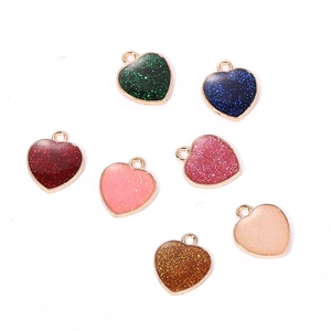 DIY colorful heart pendants with glitter resin and gold metal frames in seven colors