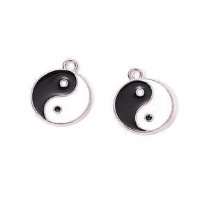 Detail of Yin Yang Tai Chi round pendants with black and white enamel drip process