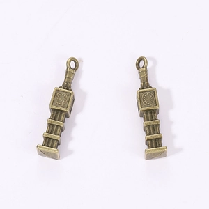 Macro detail of antique bronze Big Ben clock tower charms for DIY jewelry making