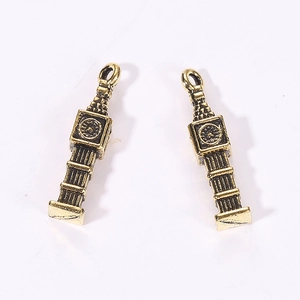 Close-up of antique gold Big Ben clock tower pendants with vintage black details for DIY crafts