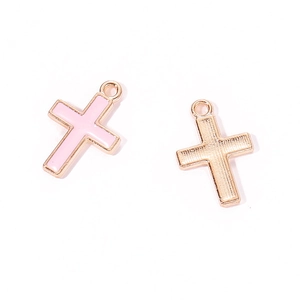 Detailed macro view of colorful enamel cross charms with textured gold-plated back for DIY jewelry