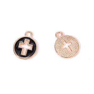 Detail of round cross pendants with black enamel inlay and textured gold alloy finish