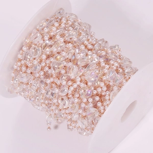 Roll of mermaid iridescent heart pearls and white beads on spool for DIY jewelry making