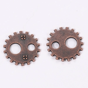 Close-up of 12mm vintage steampunk bronze gear charms for DIY craft jewelry making