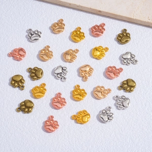 DIY colorful animal paw print charms in silver, gold, and rose gold for pet jewelry