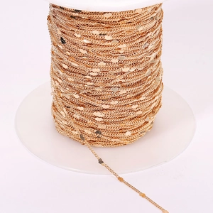 DIY heart-shaped sequin chain in gold plating wound on a spool for jewelry making
