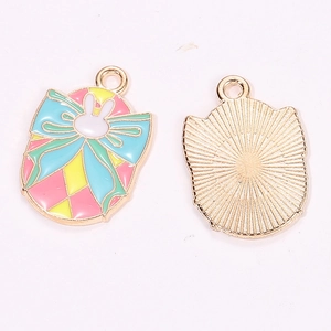 Detail of colorful enamel Easter bunny pendants with bowknot design and gold plating