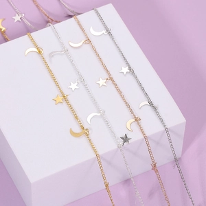 Delicate star and moon charm necklaces in gold silver and rose gold metallic finishes