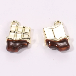 Detailed view of chocolate bar shaped alloy pendants with brown enamel and gold finish