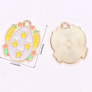Detailed view of enamel Easter egg pendant with stars, carrots and flower patterns