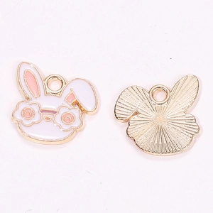 Detailed macro view showing the front and back of cartoon rabbit alloy pendants