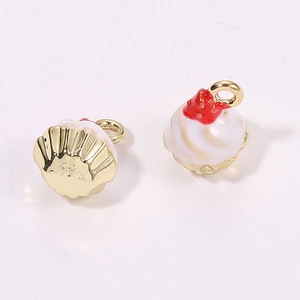 Detailed view of 3D miniature cupcake pendants with red strawberry and golden metal cup base