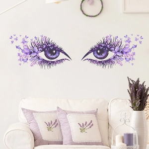 Artistic purple eyes wall sticker with butterflies and lavender decor over a white sofa