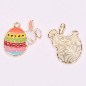 Detailed front and back view of Easter egg bunny charms with colorful enamel and gold metal