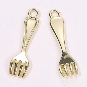 Detailed view of two polished gold-plated fork pendants for DIY jewelry making