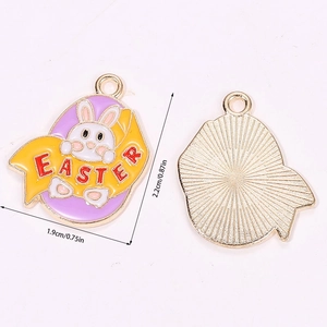 Front and back detail of Easter bunny enamel egg pendant with gold trim and textures