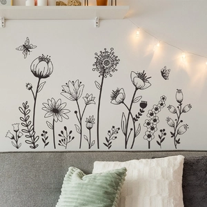 Stickers muraux modernes avec fleurs et papillons noirs pour décoration murale épurée