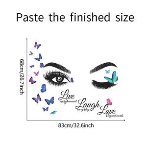 Detailed wall sticker layout featuring artistic eyes, butterflies and Live Laugh Love text
