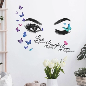 Creative wall decal with eye lashes, butterflies and Live Laugh Love motivational quotes