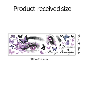 Detail of wall decal set with purple butterflies and female eye pattern measuring 90x30cm
