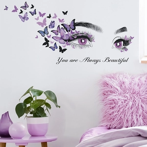 Purple eye and butterflies wall sticker with 'You are Always Beautiful' quote on white wall