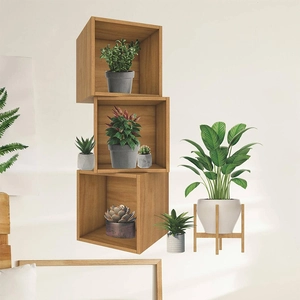 Modular wooden floating shelves with small succulent plants and potted greenery decor