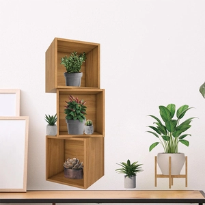 Three-piece modular wooden cube shelving set with natural grain for wall decor