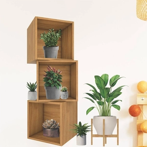 Detail of a 3-tier staggered square wooden floating shelf for wall-mounted plant decoration