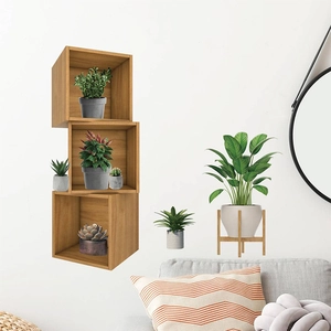 Three-tier square wooden wall shelf for plants and home decor on a white wall