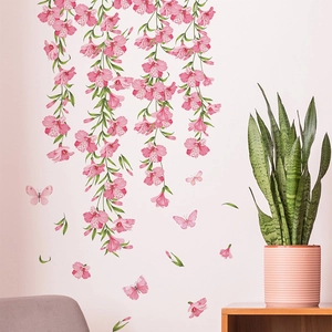 Floral wall decal featuring pink hanging lily clusters and butterflies for living room decor