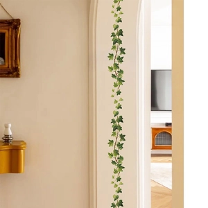 Green hanging ivy vine wall stickers for home decor on a white arched doorway
