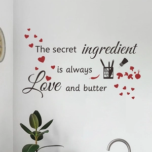 Love and Butter kitchen wall decal with heart graphics on a white wall surface