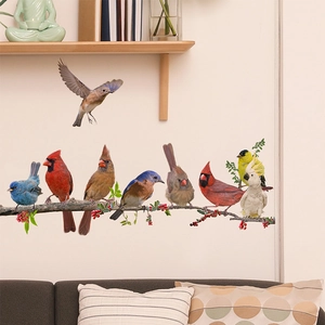 Detail of realistic bird wall stickers perched on berry branches for home decor