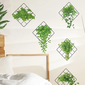 Modern wall-mounted black diamond iron mesh grid with hanging green plants for home decor