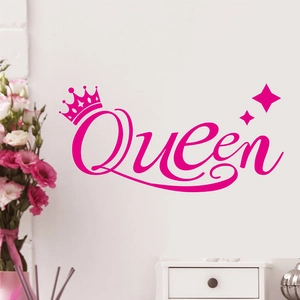 Close-up of deep pink Queen wall decal with crown sticker on a clean white wall