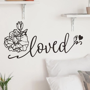 Minimalist 'loved' wall decal with hand-drawn floral patterns and heart for bedroom decor