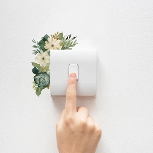 Minimalist green leaf and white flower wall stickers for light switch decoration